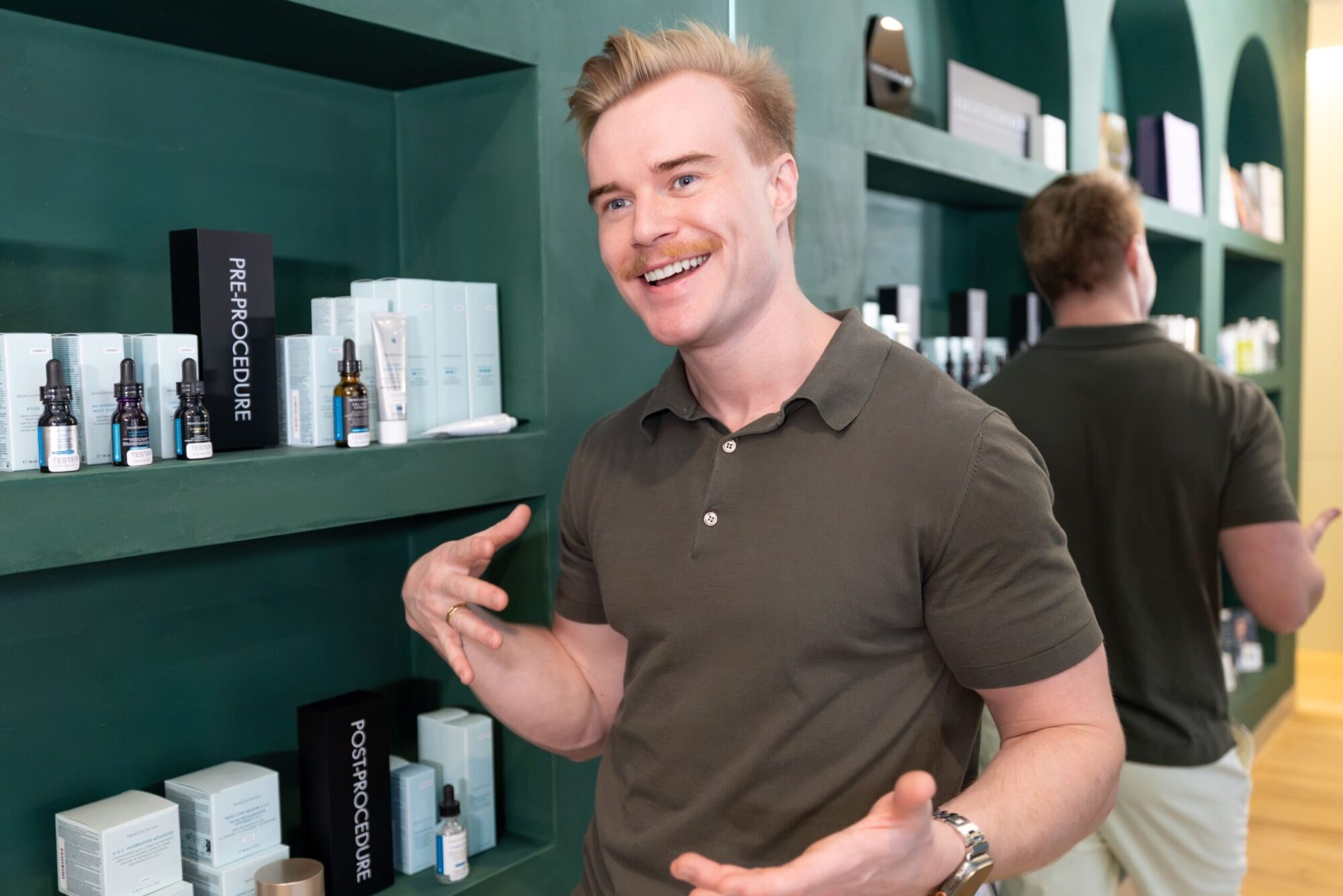 Dr Brandon Kober-Brown with medical-grade skincare products at Cleon clinic, Potts Point Sydney