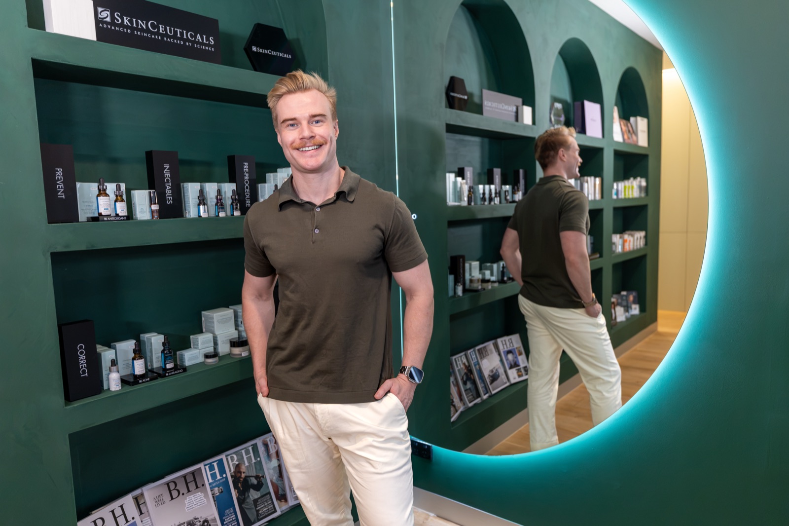 Dr Brandon standing by the SkinCeuticals shelves in the Cleon clinic, Potts Point